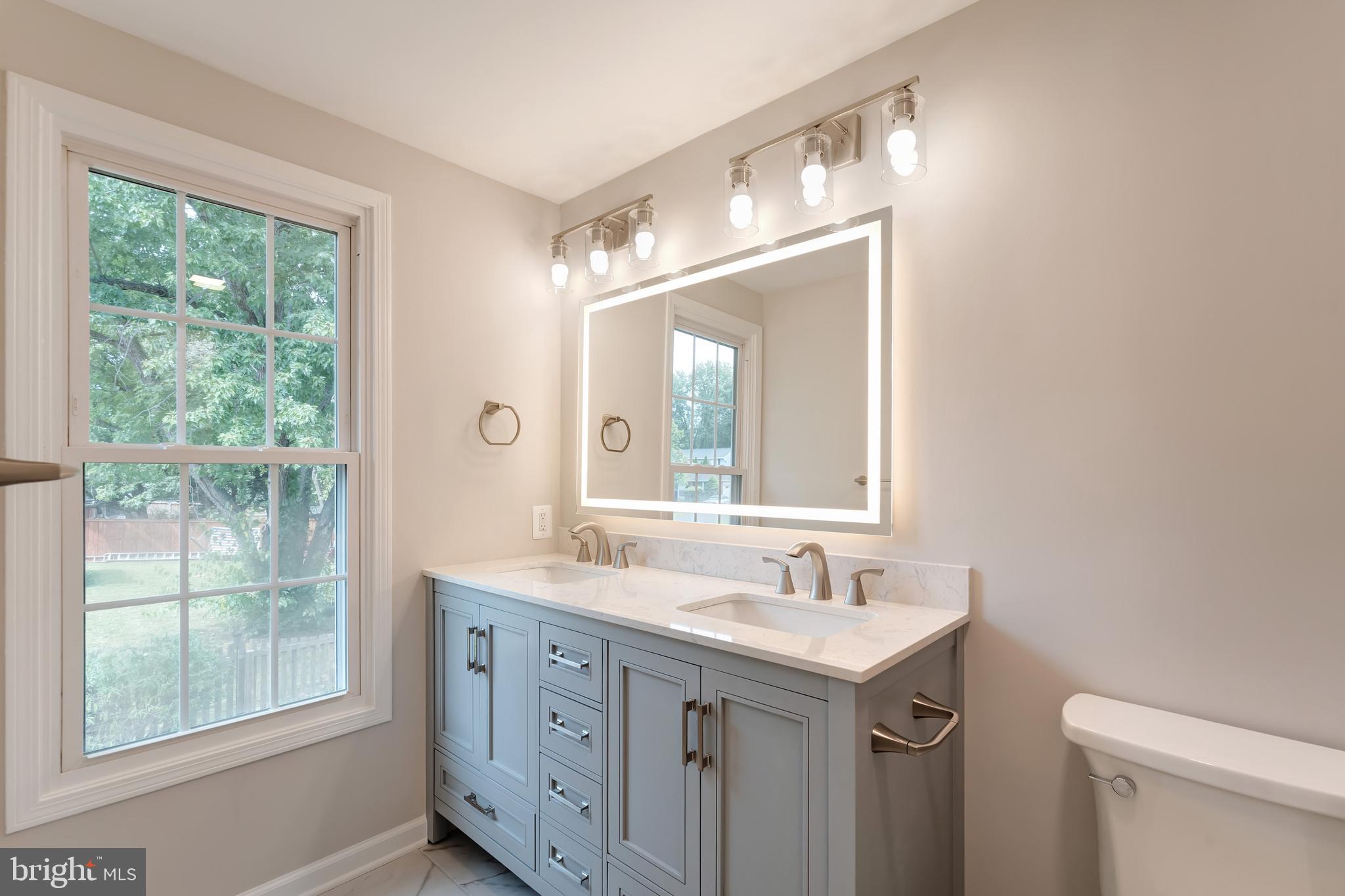 1330 Rock Chapel Road Herndon, VA 20170 - Photo 27 of 41 REMODELED OWNER'S BA-RAISED VANITY, LIGHTED MIRROR
