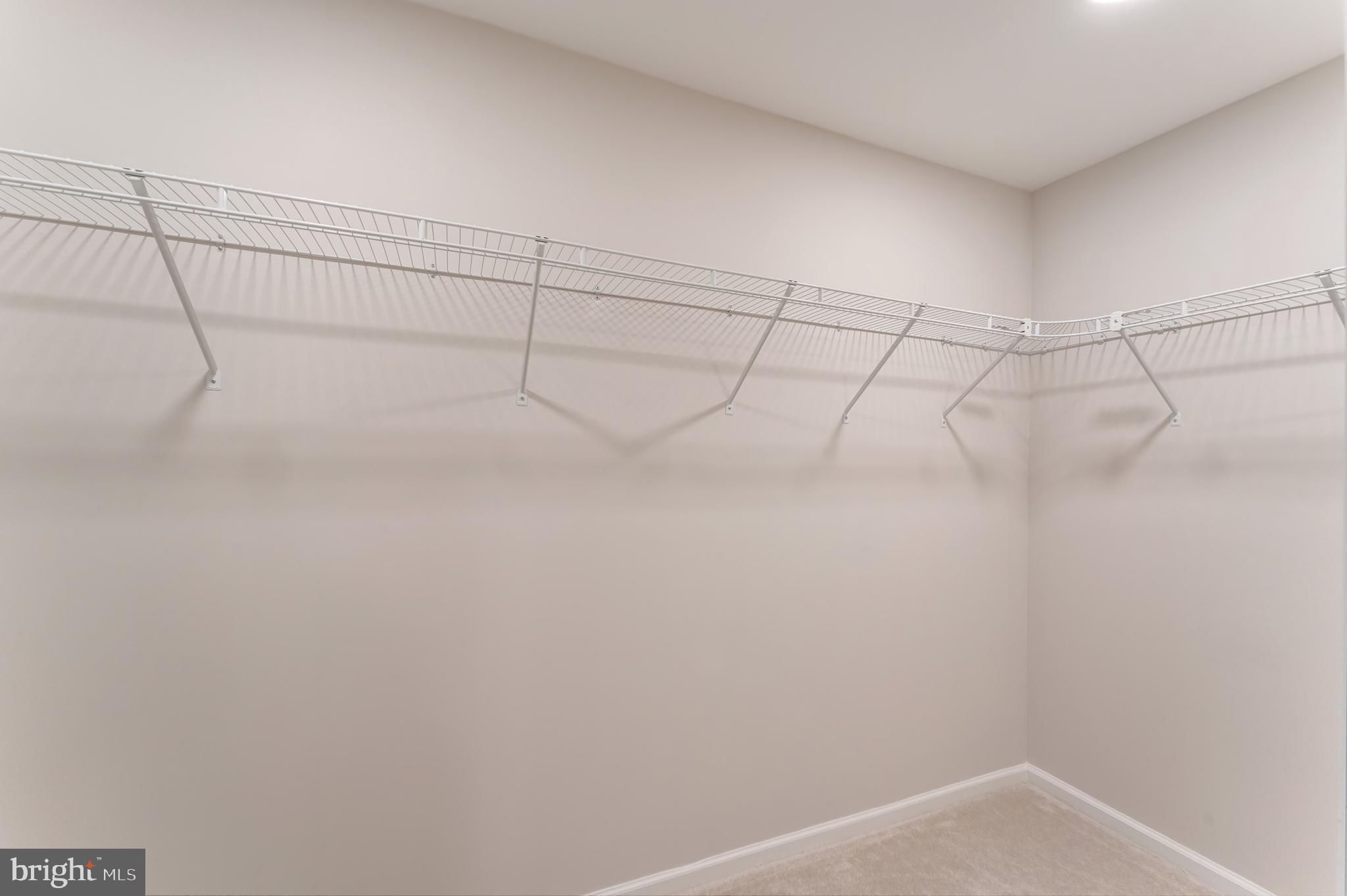 1330 Rock Chapel Road Herndon, VA 20170 - Photo 29 of 41 RECONFIGURED L-SHAPED WALK-IN CLOSET IN OWNER'S RM