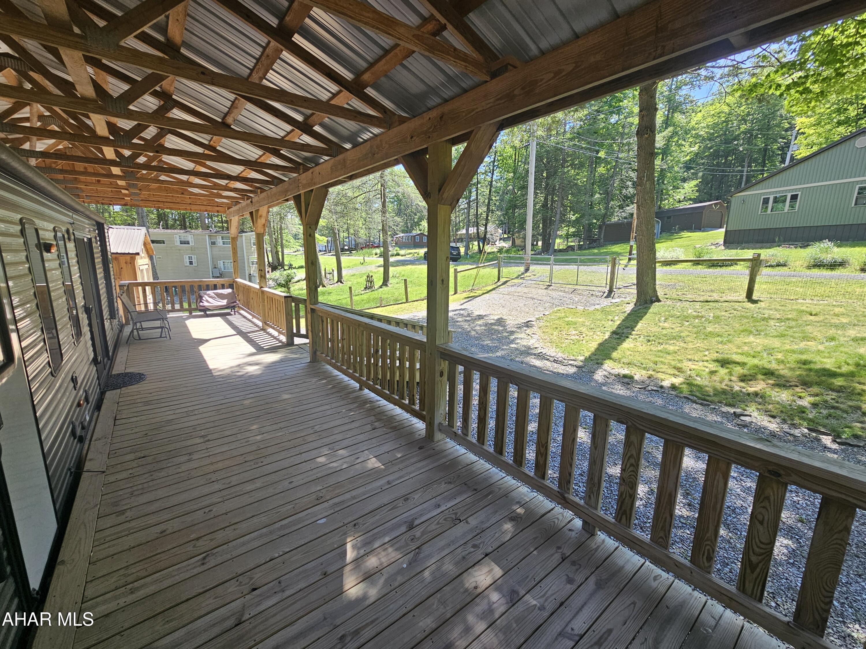 137 Mimosa Circle Flinton, PA 16640 - Photo 9 of 18 a view of a porch with wooden floor and outdoor space