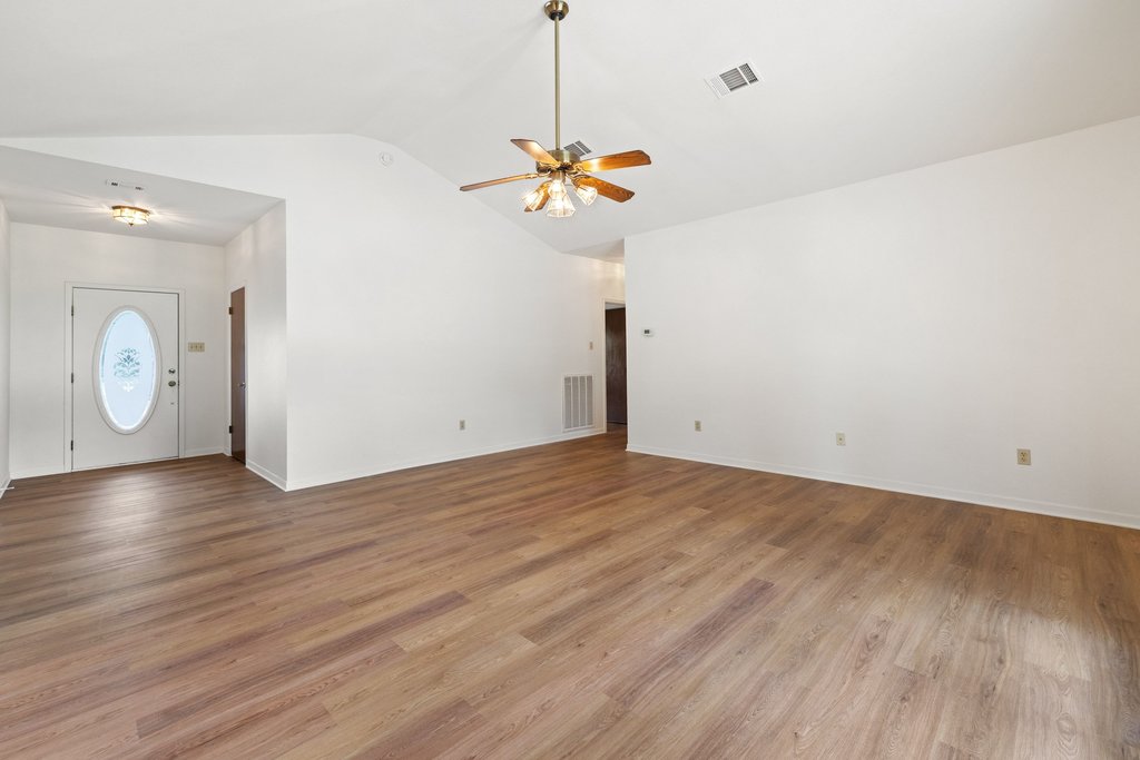 244 Woodway Elgin, TX 78621 - Photo 9 of 40 a view of a room with wooden floor and fan