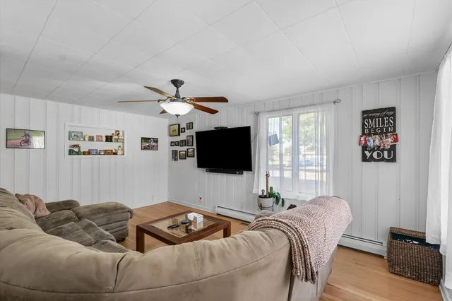 a bathroom with a sink vanity mirror and toilet