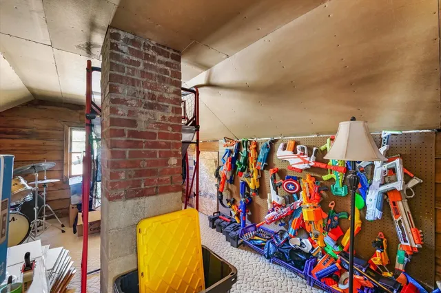 a view of a porch with furniture and a yard