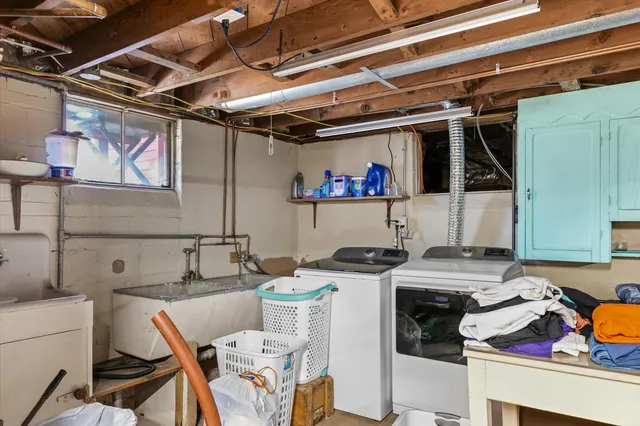 a view of a chairs and table in front of house