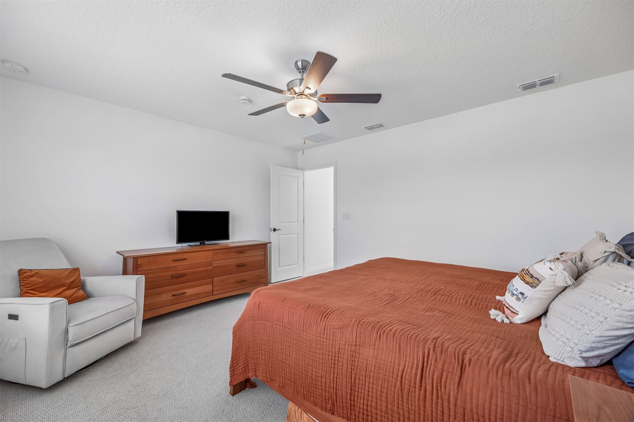 236 Hawthorn Park Circle Yulee, FL 32097 - Photo 15 of 28 a bedroom with a bed and a couch