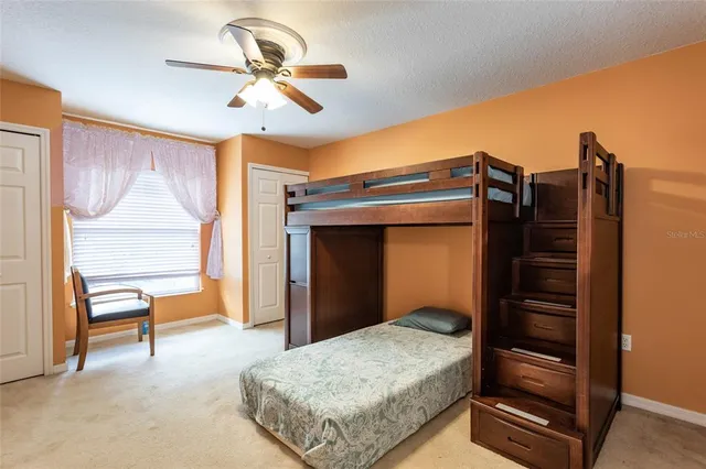 a bathroom with a toilet and a glass shower door