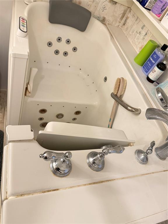 5109 Southwest 10th Street Bell, FL 32619 - Photo 33 of 38 a bathroom with a sink and mirror