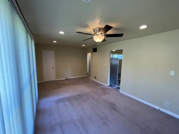 a view of a bathroom from a hallway