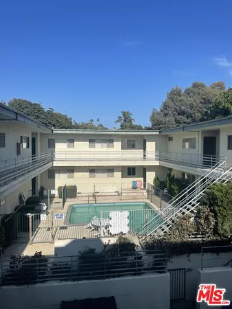 a view of a swimming pool with a patio