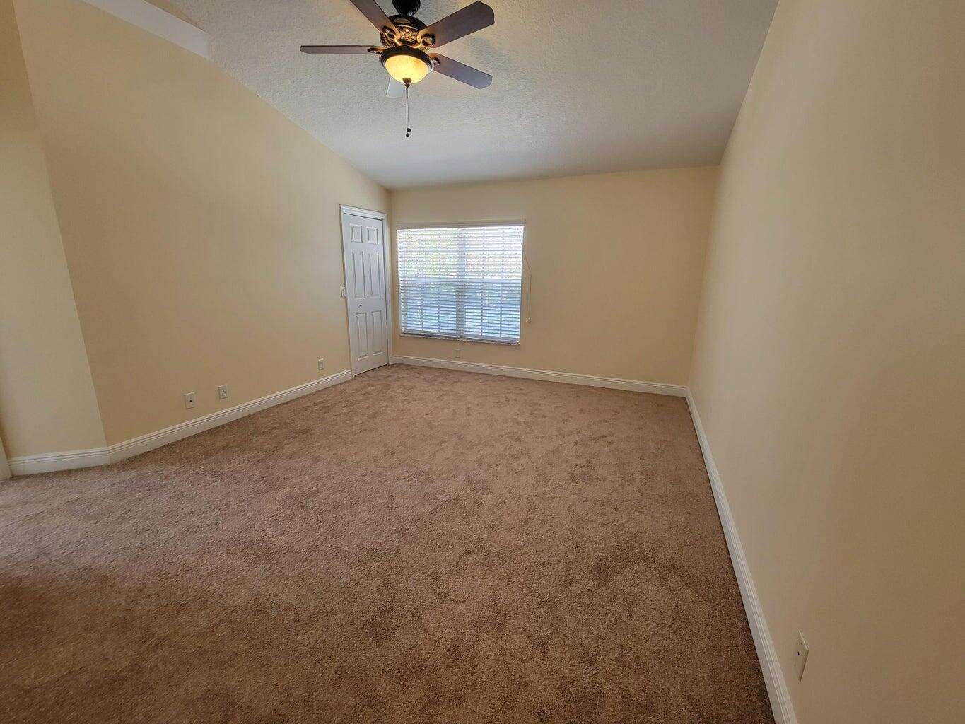 330 Clocktower Drive Jupiter, FL 33458 - Photo 13 of 19 a view of an empty room and chandelier fan