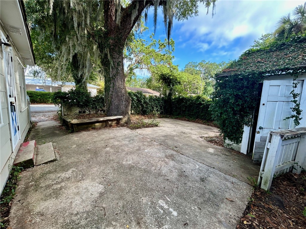 11822 Old Demere Road St. Simons Island, GA 31522 - Photo 15 of 15 Back Patio with Laundry Shed