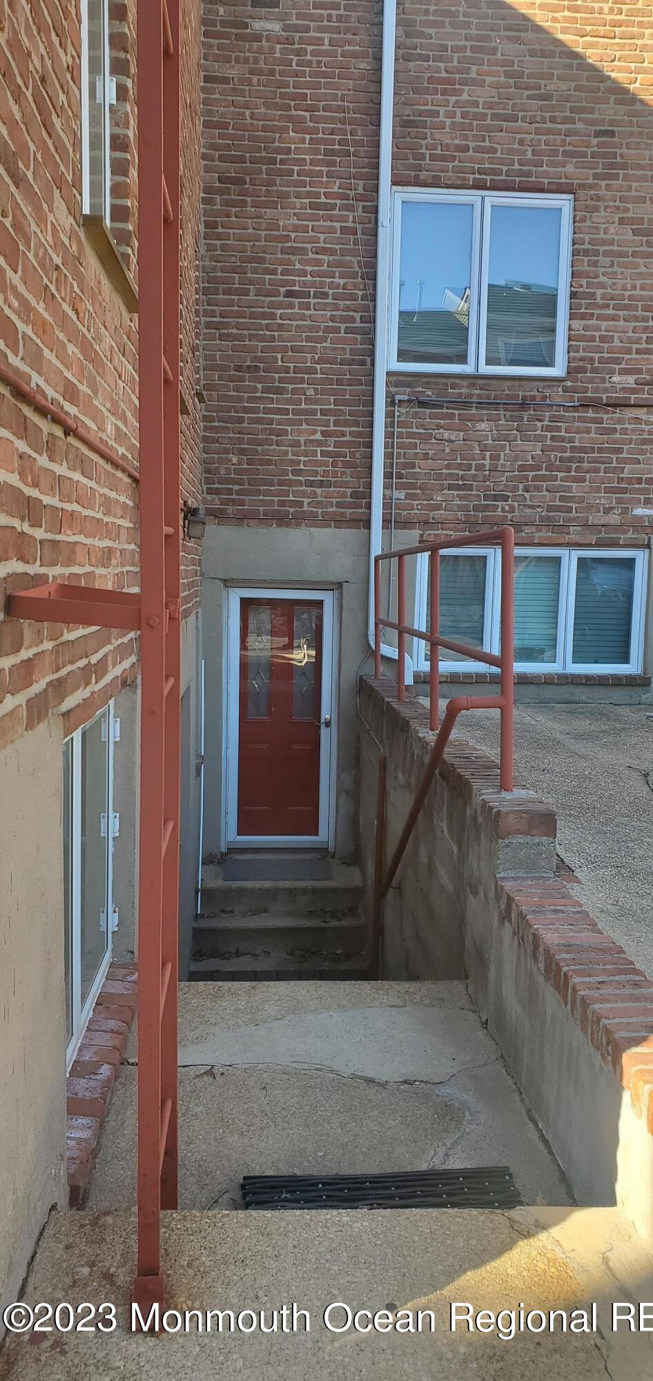 293 Spring Street, Unit 16A Red Bank, NJ 07701 - Photo 15 of 15 a building with a door and a window