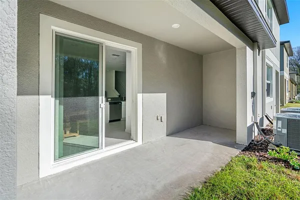 a front view of a house with a garden and yard