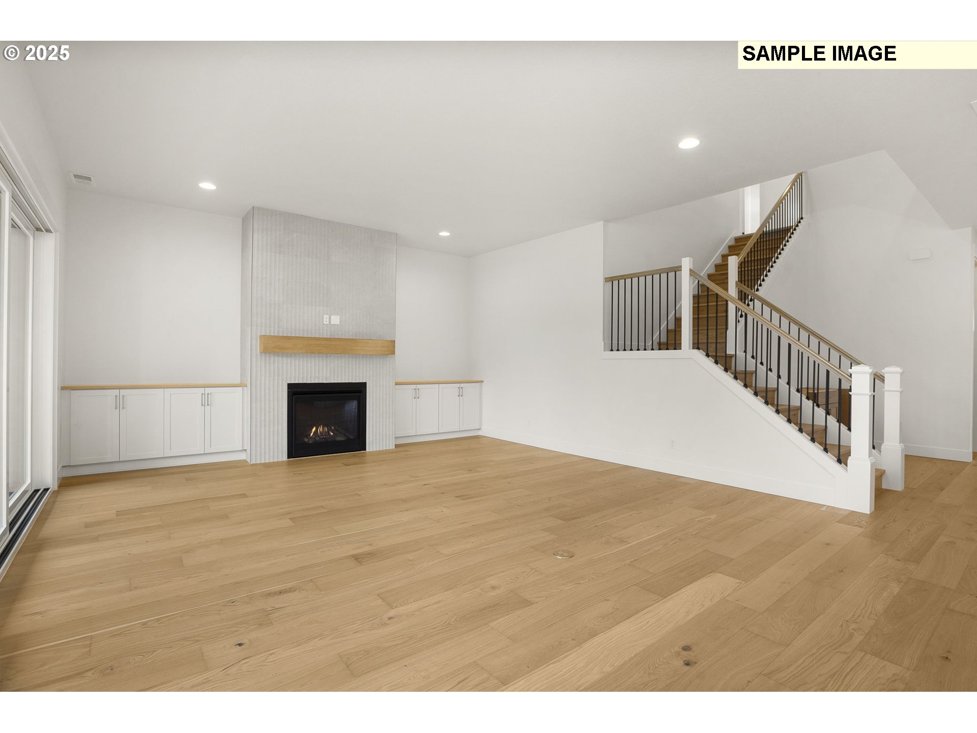 3780 Ridgewood Way West Linn, OR 97068 - Photo 11 of 28 a view of empty room with wooden floor and fireplace