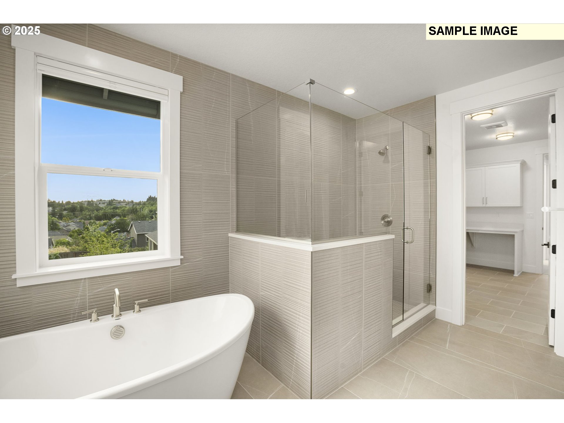 3780 Ridgewood Way West Linn, OR 97068 - Photo 16 of 28 a bathroom with a bathtub a sink and a window