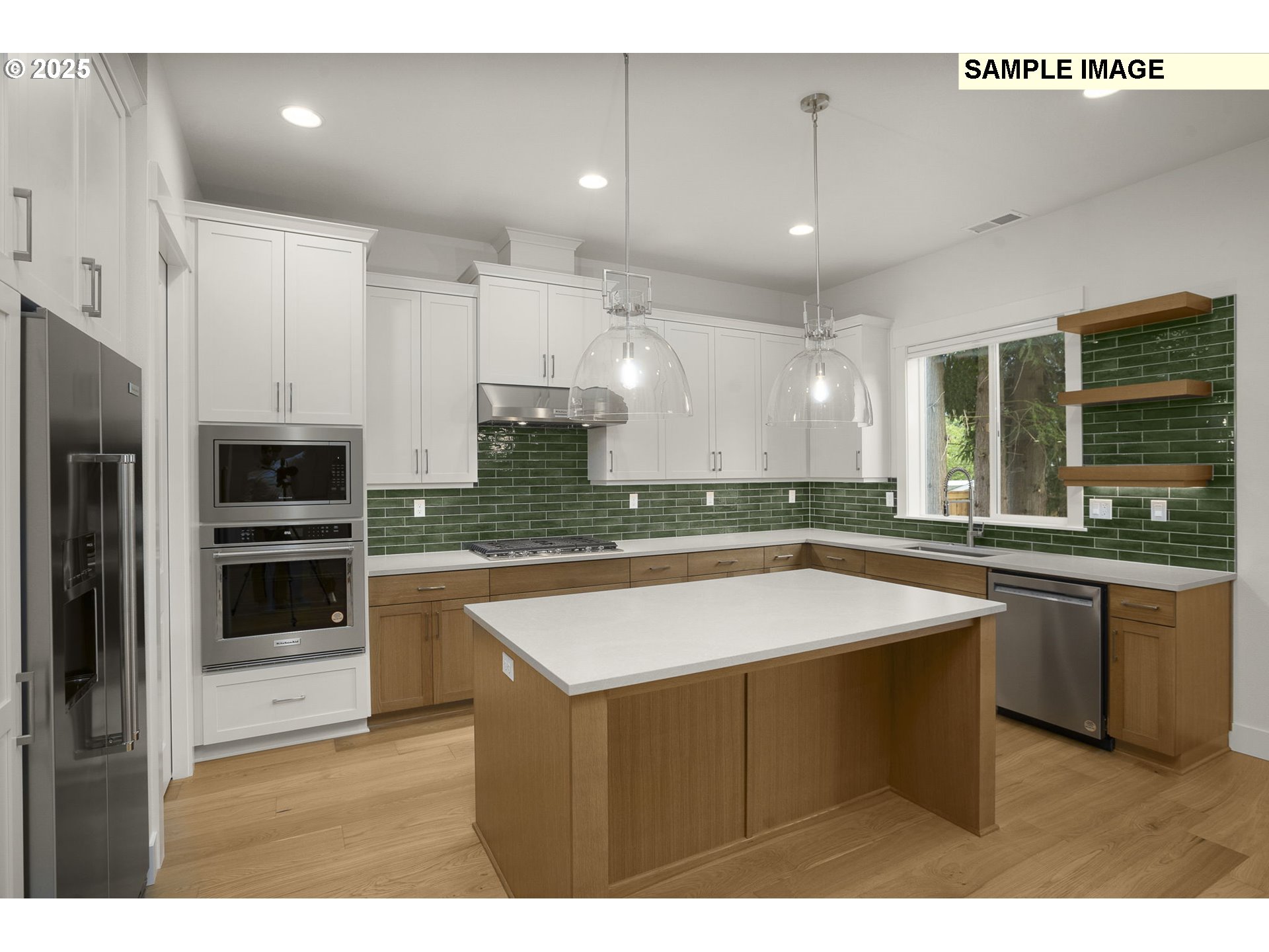 3780 Ridgewood Way West Linn, OR 97068 - Photo 5 of 28 a kitchen with stainless steel appliances granite countertop a sink a stove and a refrigerator