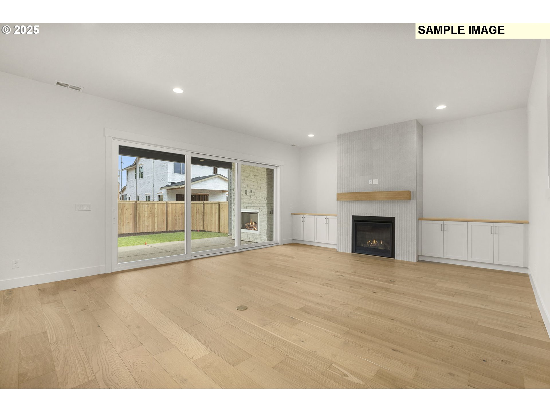 3780 Ridgewood Way West Linn, OR 97068 - Photo 10 of 28 a view of empty room with wooden floor and fireplace
