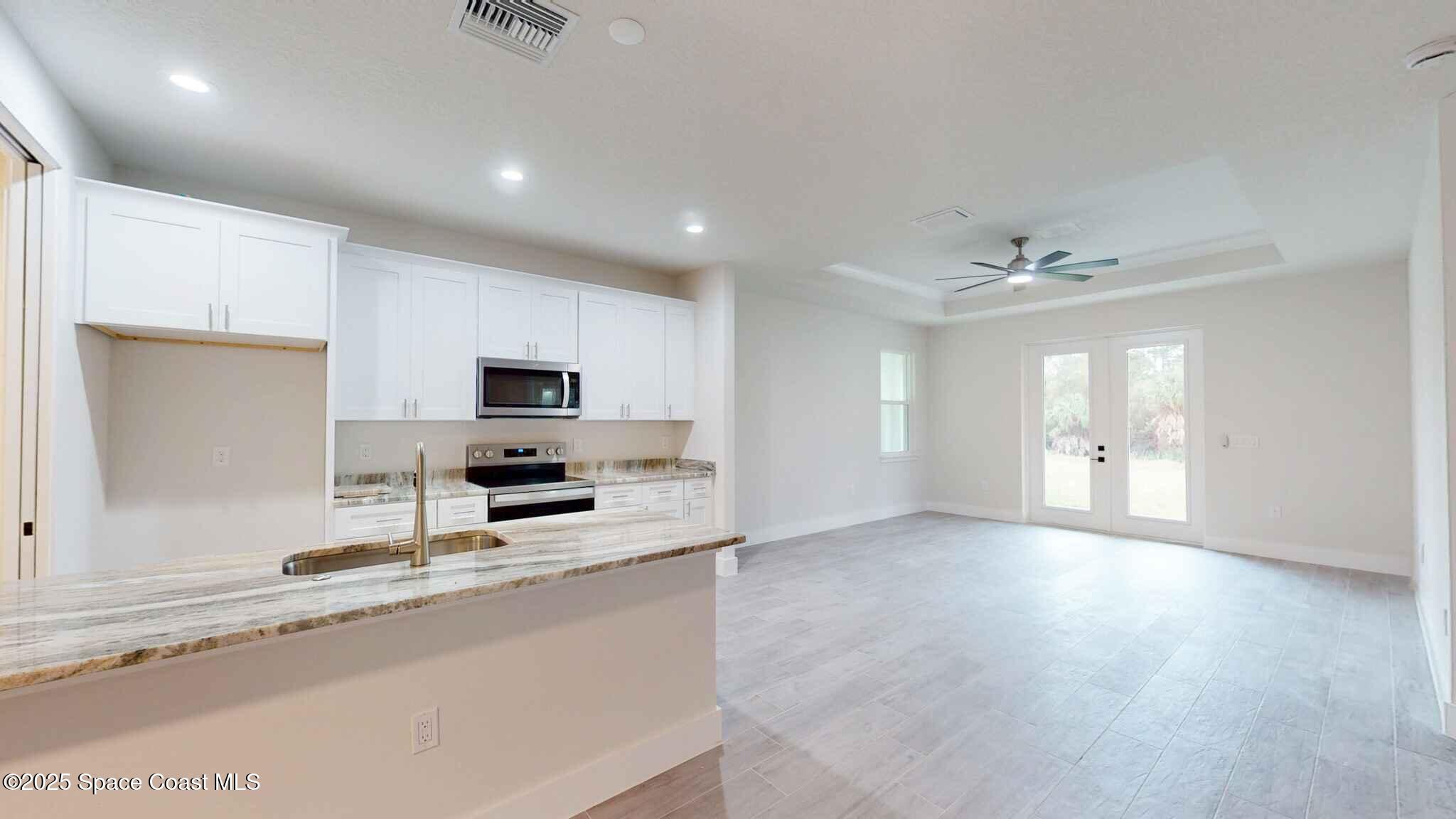 268 Barbarossa Road Northwest Palm Bay, FL 32907 - Photo 8 of 26 Kitchen Living
