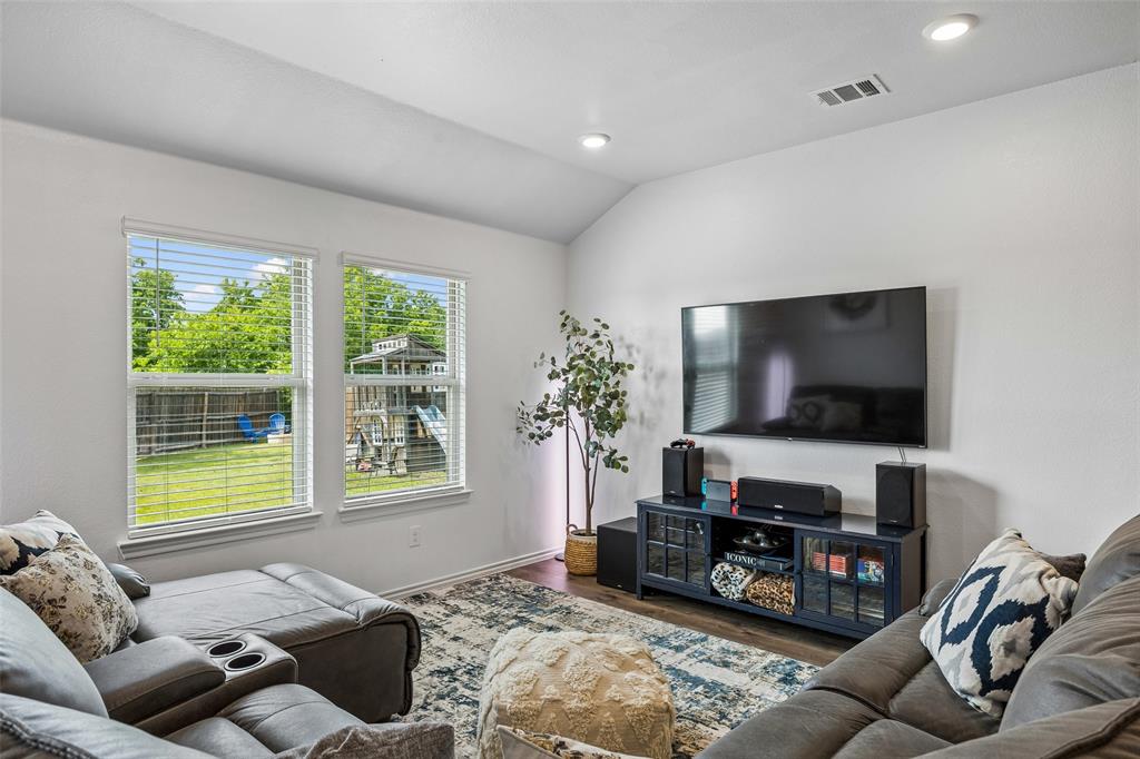 802 Rustic Way Royse City, TX 75189 - Photo 22 of 38 a living room with furniture and a flat screen tv