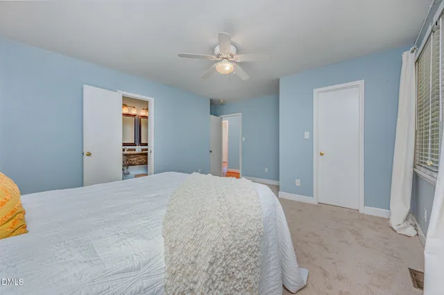 a bathroom with a sink a vanity and a window