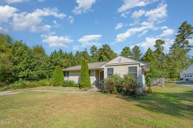 a balcony with wooden floor and fence