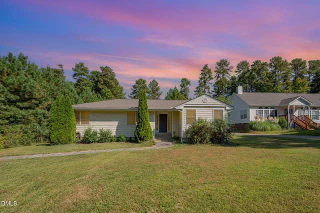 a backyard of a house with lots of green space