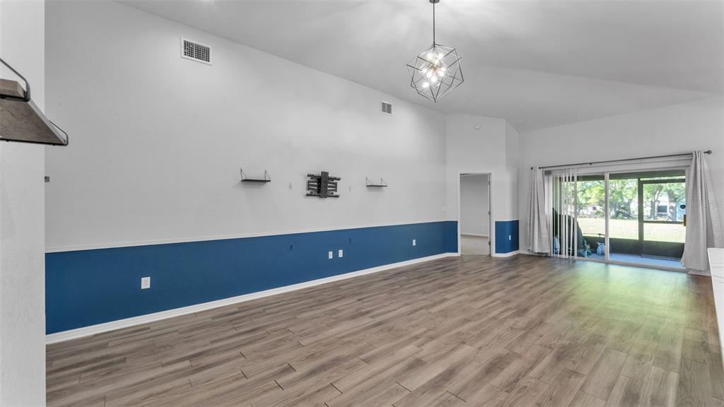 501 Interlock Street Lake Alfred, FL 33850 - Photo 16 of 49 a view of wooden floor and windows in a room