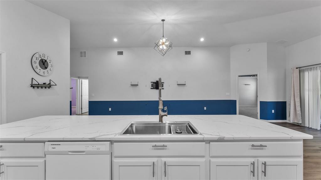 501 Interlock Street Lake Alfred, FL 33850 - Photo 20 of 49 a kitchen with a sink a chandelier and living room view