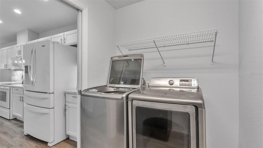 501 Interlock Street Lake Alfred, FL 33850 - Photo 23 of 49 a utility room with dryer and washer