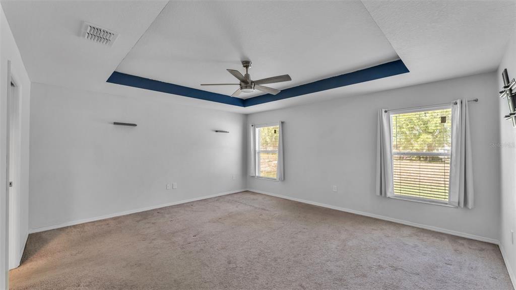 501 Interlock Street Lake Alfred, FL 33850 - Photo 24 of 49 an empty room with windows and fan