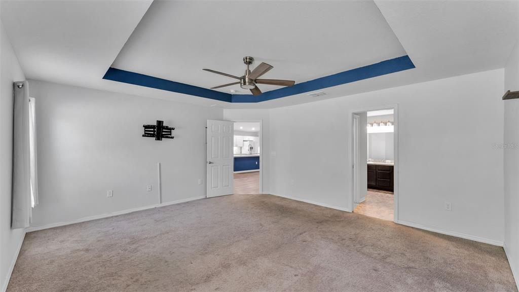 501 Interlock Street Lake Alfred, FL 33850 - Photo 25 of 49 a view of an empty room with a ceiling fan