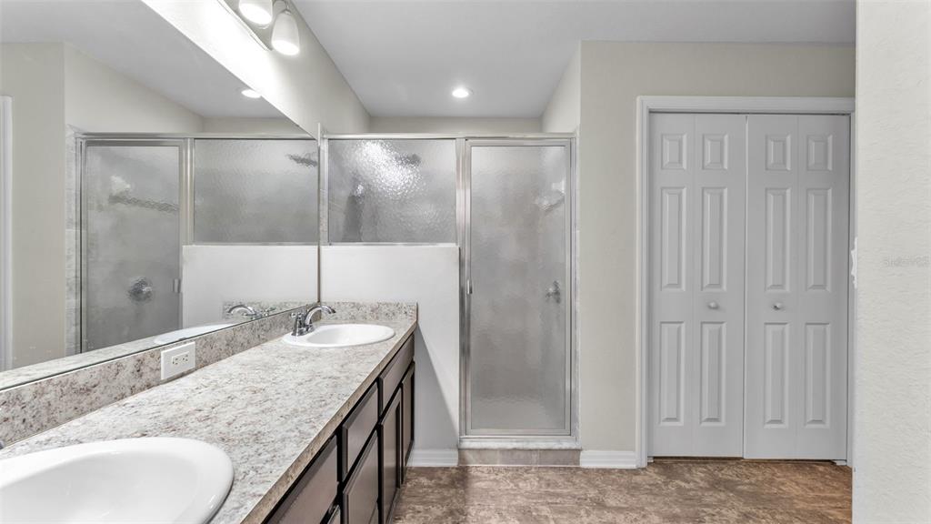 501 Interlock Street Lake Alfred, FL 33850 - Photo 28 of 49 a bathroom with a granite countertop sink and a mirror