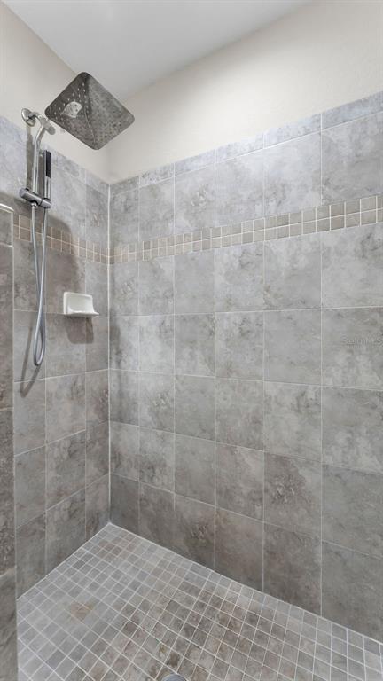 501 Interlock Street Lake Alfred, FL 33850 - Photo 30 of 49 a bathroom with a shower