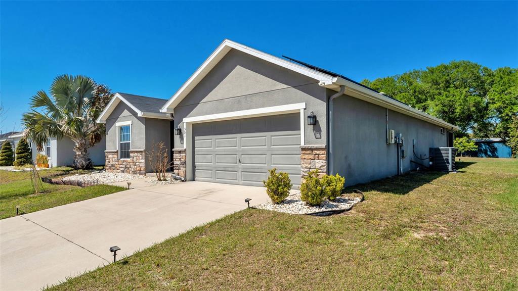501 Interlock Street Lake Alfred, FL 33850 - Photo 3 of 49 a front view of a house with a yard