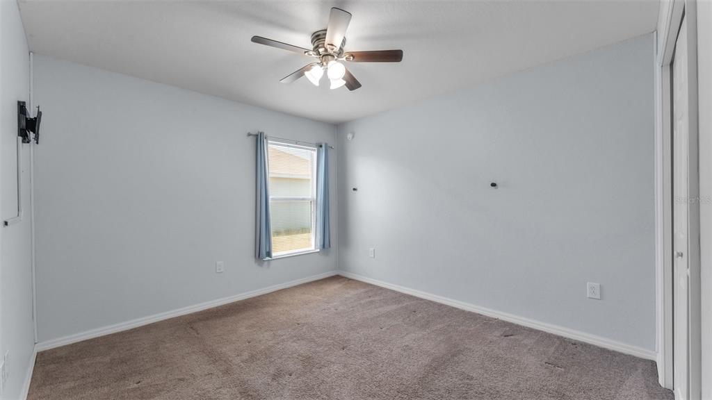 501 Interlock Street Lake Alfred, FL 33850 - Photo 31 of 49 an empty room with a window and a fan