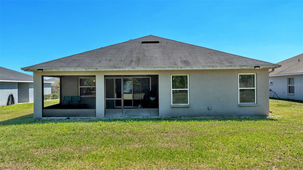 501 Interlock Street Lake Alfred, FL 33850 - Photo 40 of 49 a view of a house with a yard