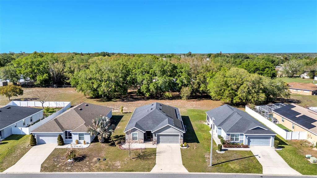 501 Interlock Street Lake Alfred, FL 33850 - Photo 43 of 49 an aerial view of residential houses with outdoor space and trees