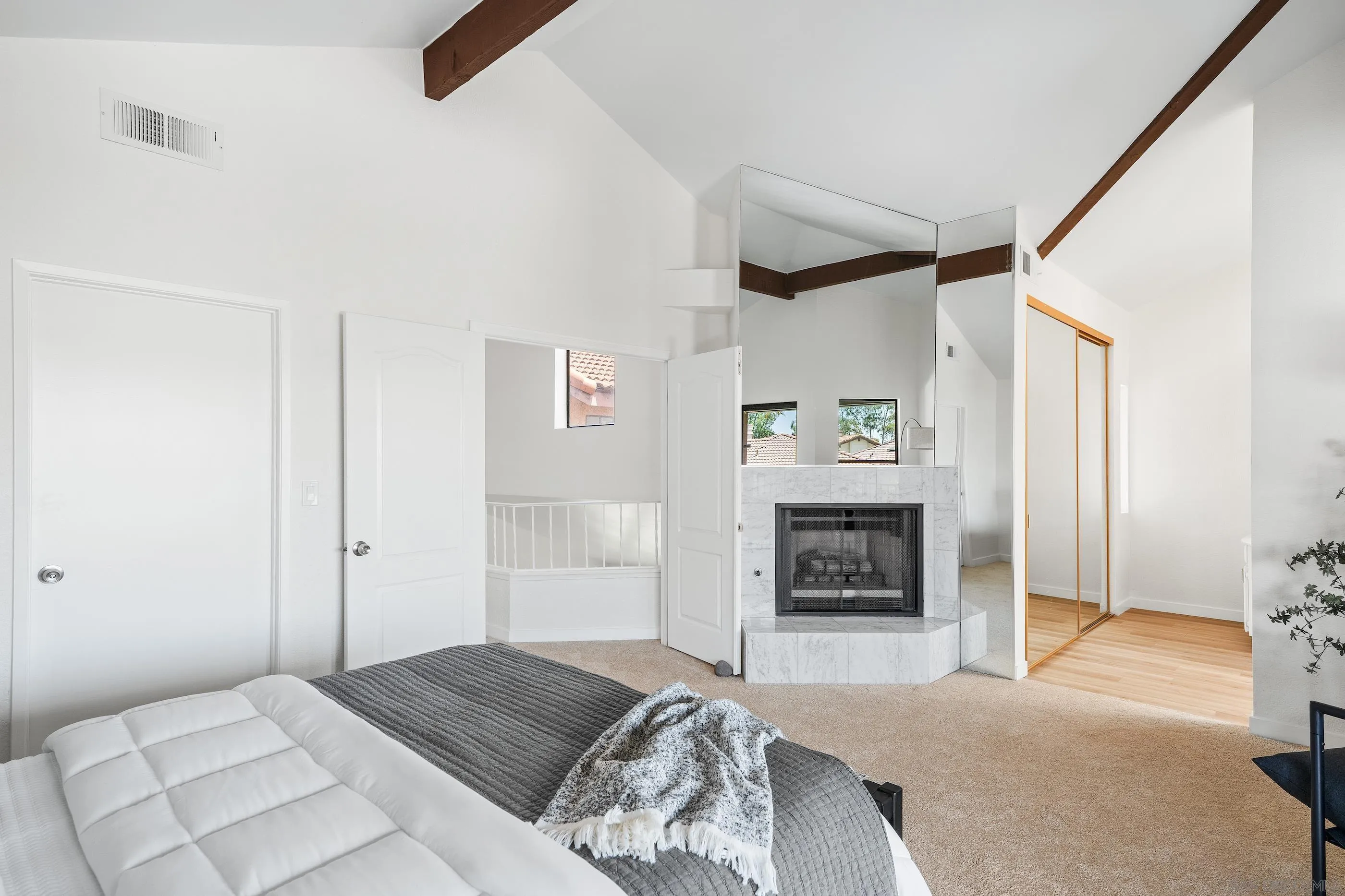 10015 Vallata Court Spring Valley, CA 91977 - Photo 20 of 33 a bedroom with a bed and a fireplace