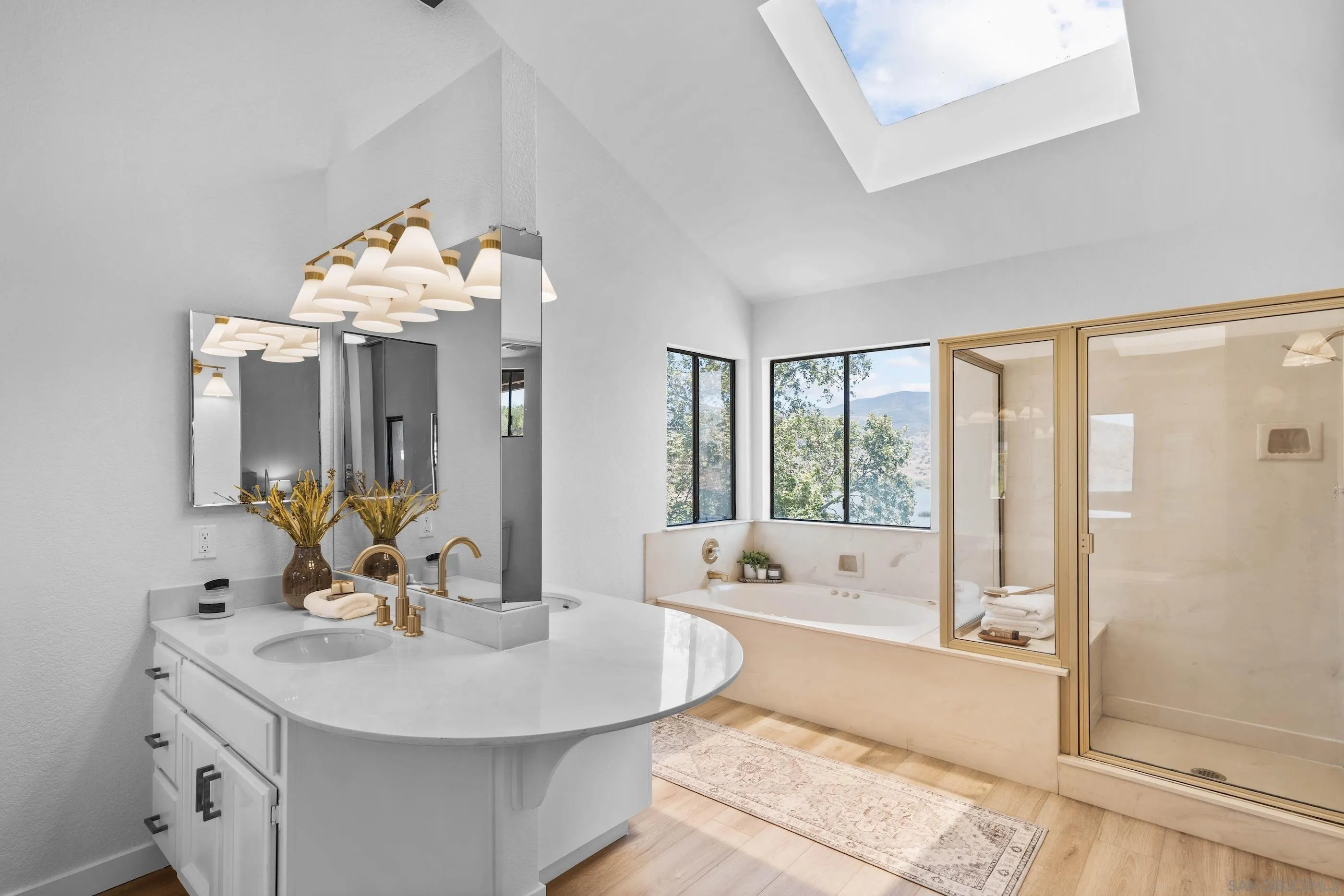 10015 Vallata Court Spring Valley, CA 91977 - Photo 21 of 33 a bathroom with a tub sink and mirror