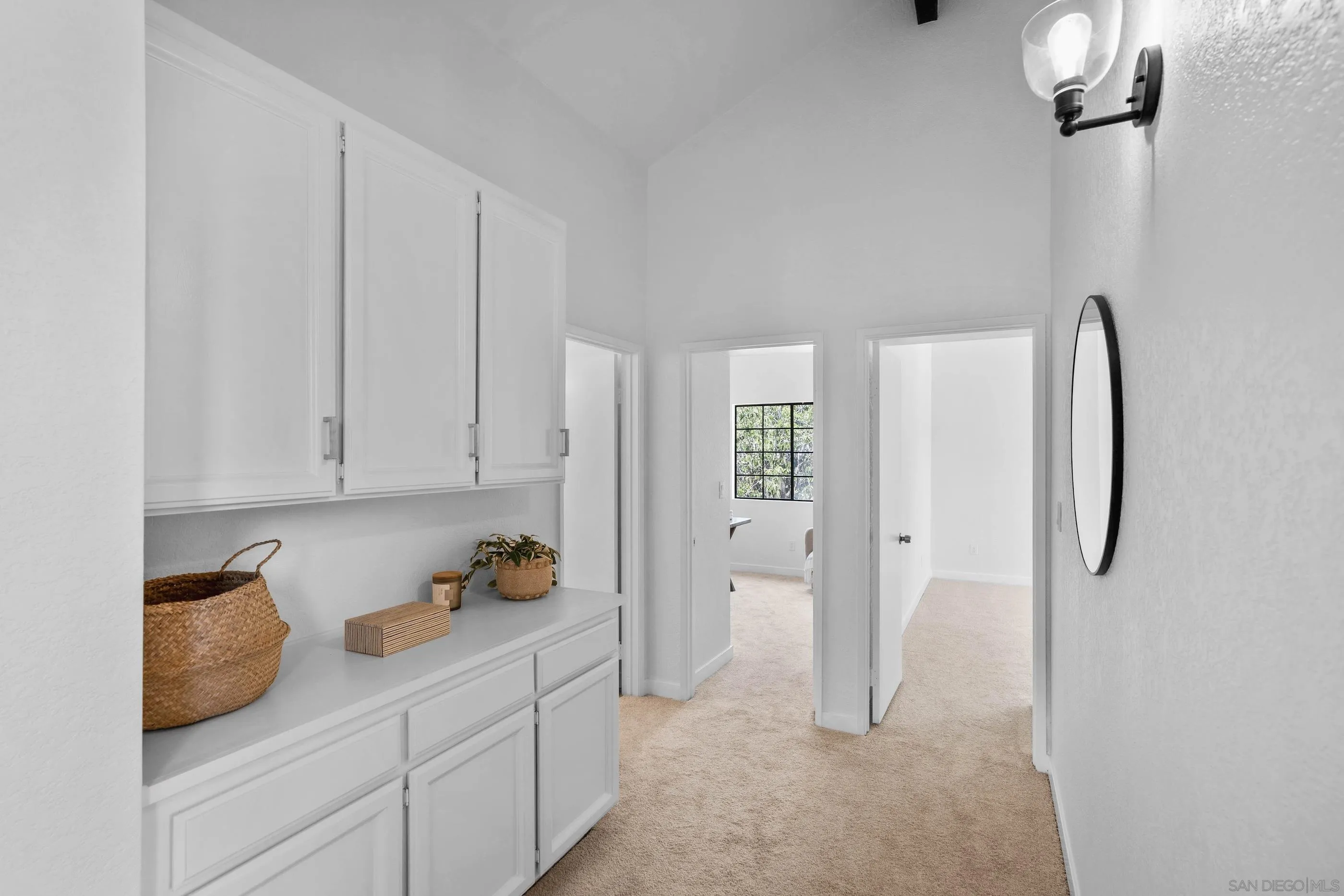 10015 Vallata Court Spring Valley, CA 91977 - Photo 23 of 33 a kitchen with stainless steel appliances granite countertop a refrigerator and white cabinets