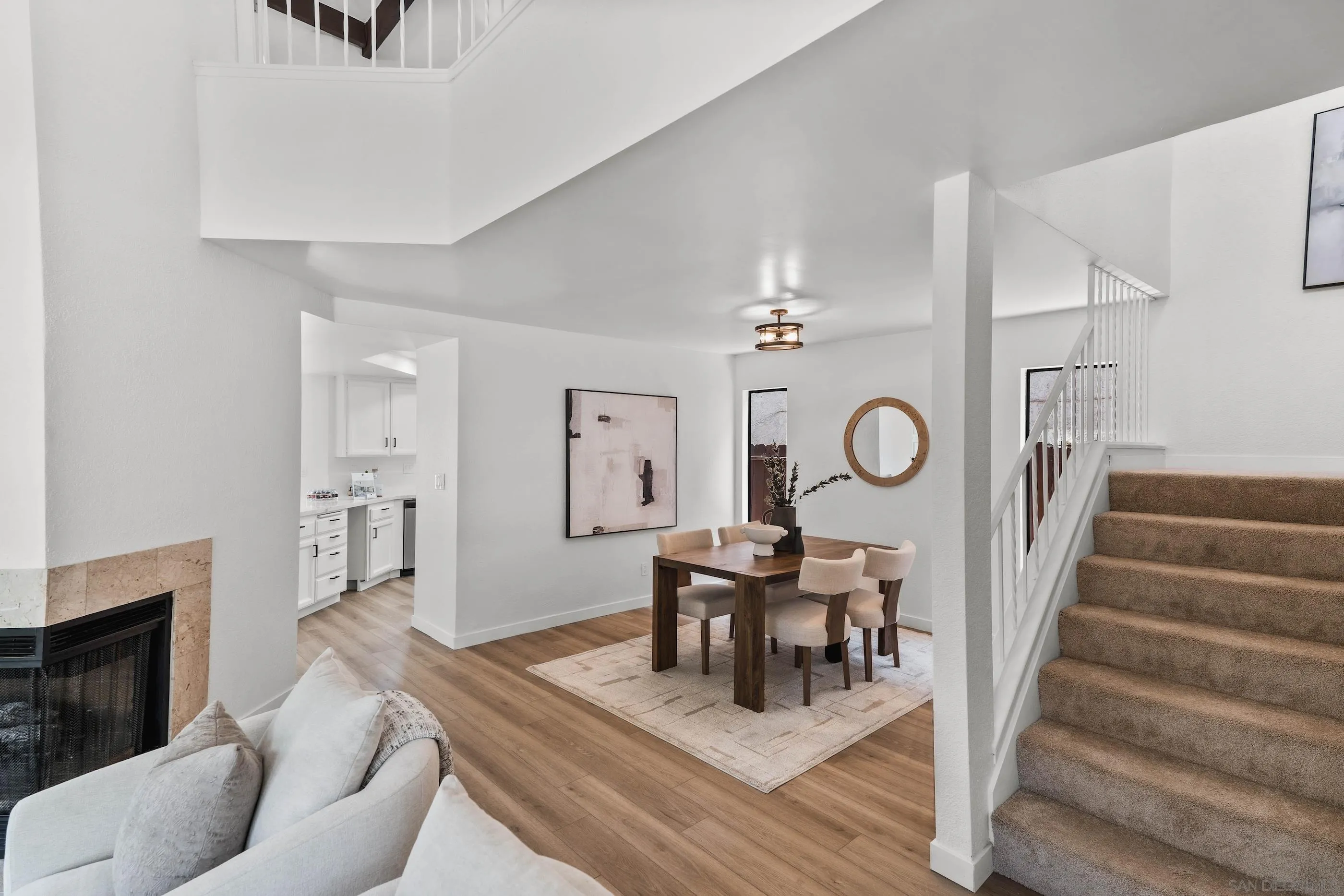 10015 Vallata Court Spring Valley, CA 91977 - Photo 5 of 33 a view of a livingroom with furniture a fireplace wooden floor and furniture