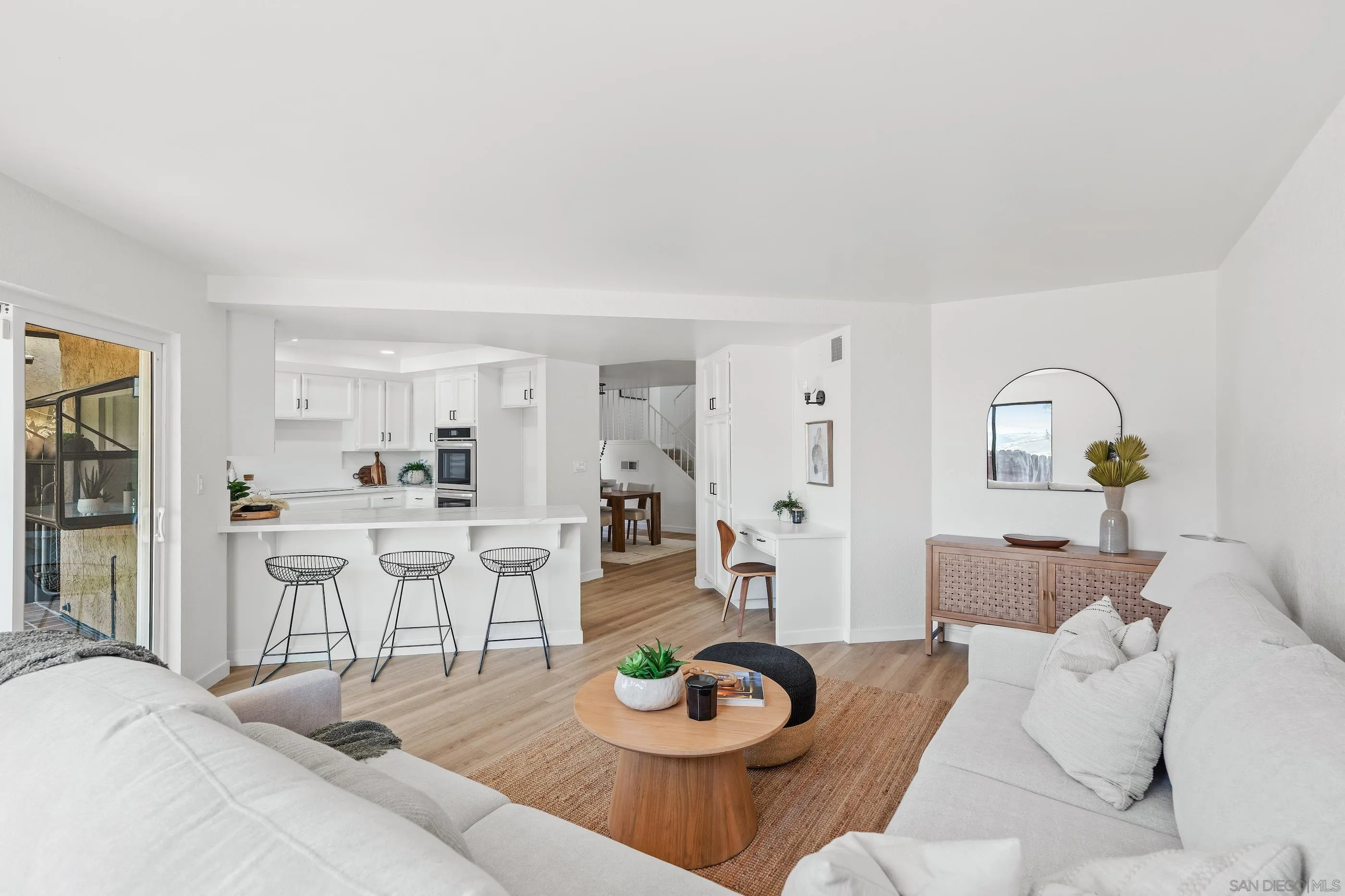 10015 Vallata Court Spring Valley, CA 91977 - Photo 10 of 33 a living room with furniture and a wooden floor
