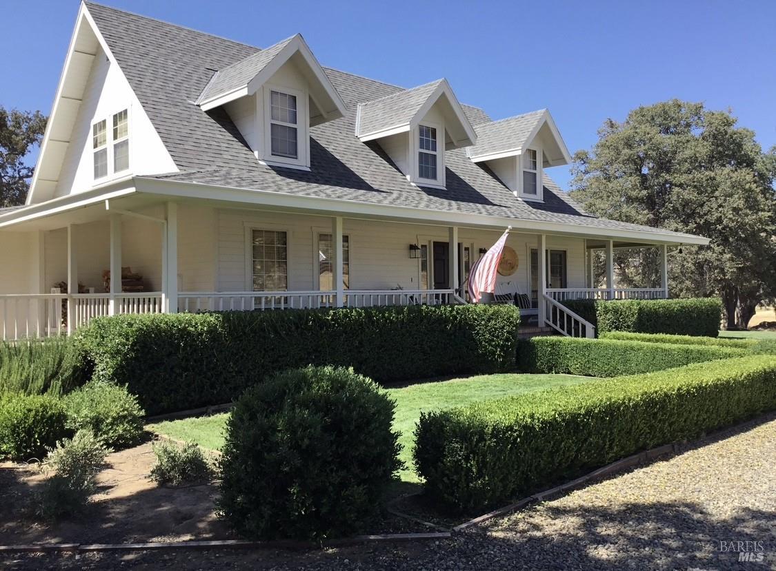 Exterior of main home with covered wrap around porch