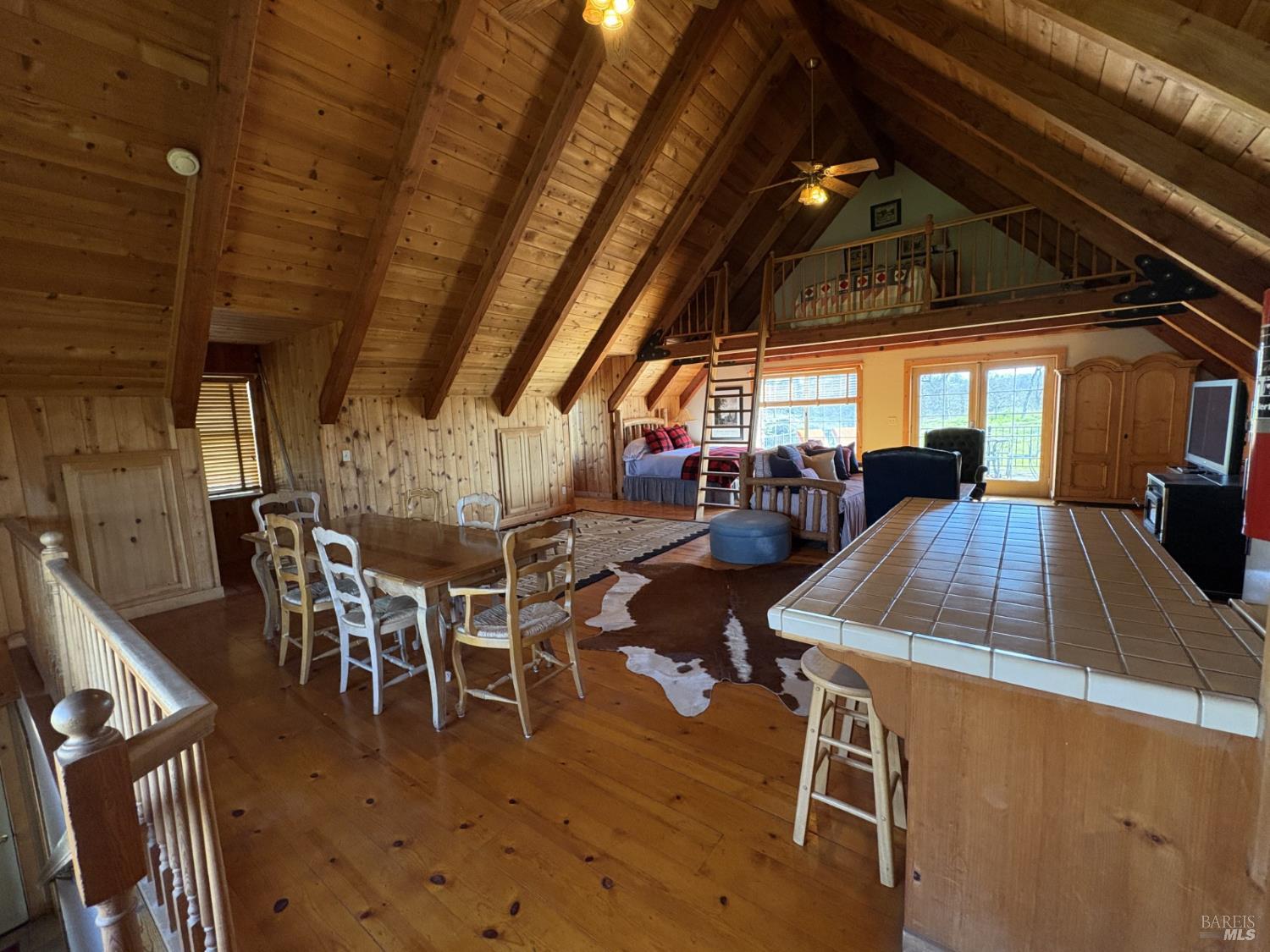 2617 South Old Highway Road Catheys Valley, CA 95306 - Photo 22 of 30 Loft with beamed ceilings , full kitchen and bath and fireplace.