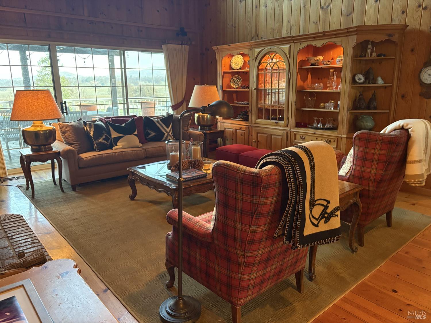 2617 South Old Highway Road Catheys Valley, CA 95306 - Photo 10 of 30 Gorgeous living room with vaulted pine ceilings and fireplace looking out to a large covered deck with stunning views.