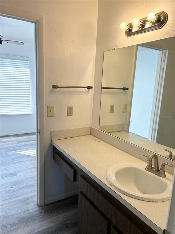 4031 Henley Road, Unit 1706 Orlando, FL 32839 - Photo 29 of 41 a bathroom with a sink and a mirror