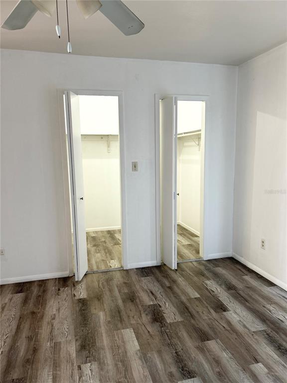 4031 Henley Road, Unit 1706 Orlando, FL 32839 - Photo 35 of 41 an empty room with wooden floor & closet area