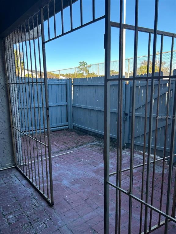 4031 Henley Road, Unit 1706 Orlando, FL 32839 - Photo 39 of 41 a view of a porch with wooden fence