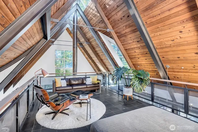 a house view with sitting space and wooden stairs