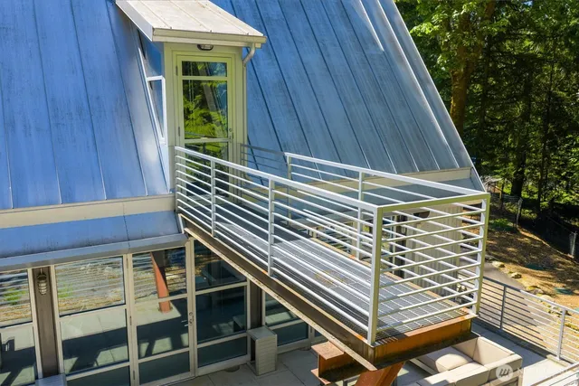 a view of balcony with wooden floor and fence