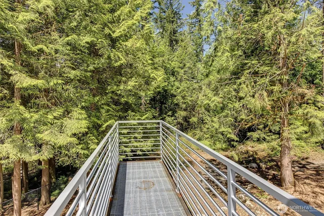 a view of a patio with wooden fence